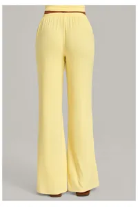Back view detail of women solid yellow wide leg yoga pants, casual loose drape trousers.