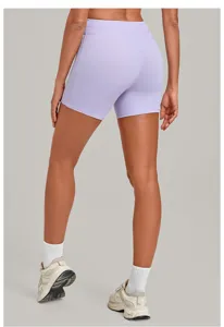 High-waist cross waistband yoga shorts rear view detail, smooth nude-feel athletic apparel.