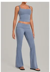 Dusty blue activewear set featuring a square neck crop tank top and fold-over flare yoga pants.
