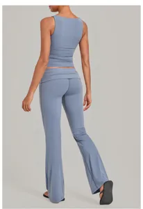 Blue two-piece yoga set with crop tank top and fold-over waist flare pants for fitness.