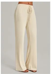 Beige straight lounge pants detail showing elastic drawstring waistband and fluid fabric.