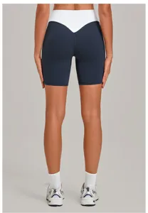 Rückansicht von Damen Fitness Shorts mit Farbblock, hoher Bund formende Sportbekleidung.