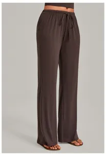 Detailed view of dark brown loose wide-leg lounge yoga pants with elastic drawstring waist.