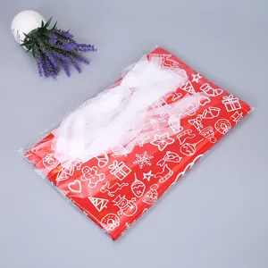 Rote Weihnachtsgeschenk Tasche für Süßigkeiten Verpackung mit weißen Motiven und Band