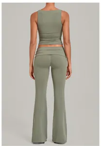 Back view detail of sage green yoga set featuring sleeveless top and flare pants.