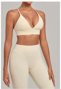 Beige sports bra and high waist yoga leggings set, ideal for fitness and gym workouts.