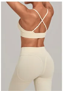Adjustable cross-back sports bra and high-waist shaping yoga leggings set in beige detail.