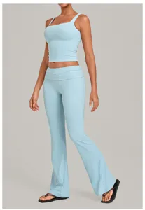 Light blue yoga set for women, featuring a tank top and fold-over waist flare pants for gym.