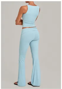Back view detail of light blue yoga set featuring a sleeveless tank top and foldover flared pants.