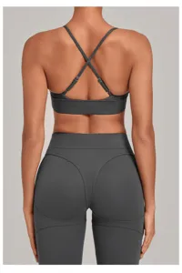 Adjustable cross-back sports bra and high-waisted fitness leggings in dark grey for women.