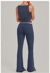 Dark blue yoga set for women, featuring a sleeveless tank top and fold-over flare pants.
