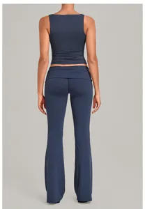 Back view detail of dark blue yoga set, featuring sleeveless crop top and fold-over pants.