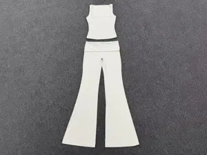 White yoga outfit set featuring a scoop neck tank top and fold over waist flare pants for fitness.