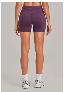 Back view detail of women high waist yoga shorts in deep purple with cross waistband design.