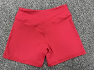 Red high-waist crossover yoga shorts for women, stretchy fitness and running activewear.