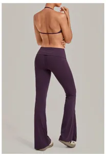 Women folded waist flare yoga pants and halter sports bra set back view fitness workout outfit