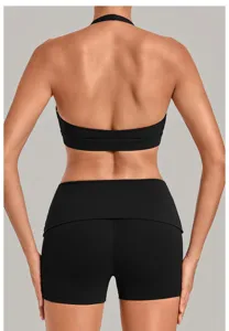 Detailed back view of a black halter sports bra and yoga shorts, perfect for fitness workouts.