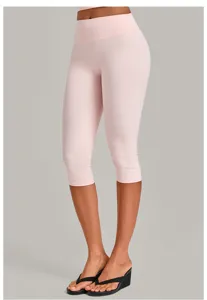 Detail view of women high-waisted pink capri yoga leggings, slim fit athletic fitness pants.