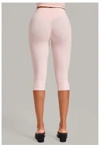 Detail view of women pink high waist butt lift cropped yoga pants, slim fit activewear style.