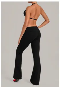 Black halter sports bra and foldover flare yoga pants set for fitness and workouts.