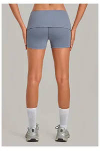 Folded waist quick-drying yoga shorts for women, tight fitness running sports apparel detail view.