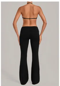 Detailed back view of the black halter bra and foldover flare yoga pants set, premium fit.