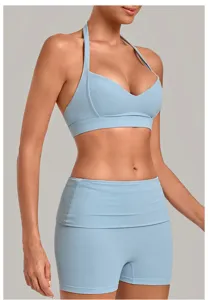 Detailed view of light blue halter yoga bra and high waist shorts, perfect for fitness.