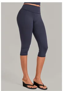 High waist athletic capri leggings detail view, tight fit yoga pants for workout and running fitness.