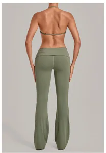 Olive green halter sports bra and fold-over waist flare yoga pants set, activewear detail.
