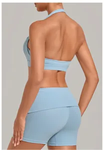 Women backless halter sports bra and yoga shorts set for fitness, running, and gym workout.