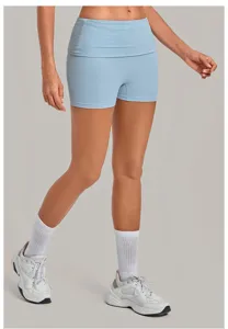Close-up detail of high-waisted folded yoga shorts, moisture-wicking fitness activewear.