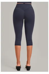 Detail view of high waist capri yoga leggings featuring tummy control and butt lifting design.