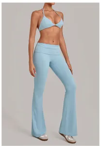 Light blue halter bra and fold-over flare yoga pants detail, soft stretchy activewear.
