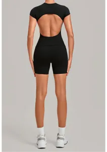 Backless yoga set for women, black fitness activewear, tight short sleeves and shorts outfit.