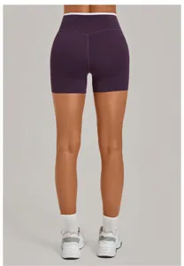 Back view detail of high-waisted purple athletic yoga shorts with white contrasting trim.