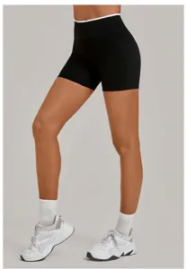 Black high-waist yoga shorts with white contrast trim for athletic fitness and running.