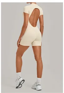 Backless design detail of the beige short sleeve fitness jumpsuit, showcasing fit.