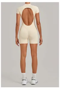 Back view detail of the beige backless yoga jumpsuit, showing slim fit and butt-lifting cut.
