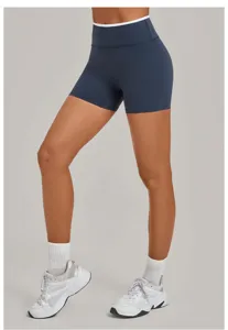Close-up detail of high-waist yoga shorts, contrast piping waistband, active fitness wear.