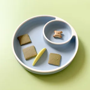 Silicone baby divided plate with compartments, cute pastel design for infant feeding and snacks.