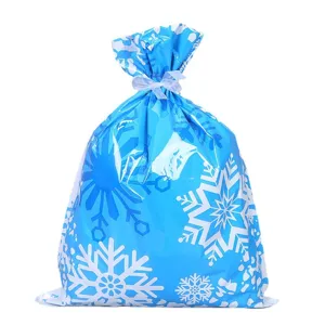 Blauer Weihnacht Schneeflocken Geschenktüte mit weißem Band Kordelzug für Feiertage Verpackung.