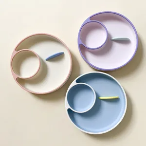 Silicone divided baby feeding plate set, cute round toddler tableware in multiple pastel colors.