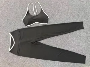 Detailed flat lay shot of black and white contrast yoga set, featuring adjustable bra.