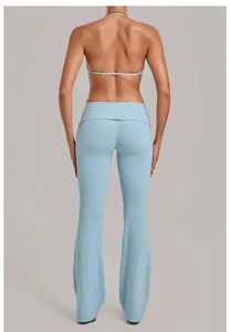 Light blue halter bra and folded waist flare yoga pants set detail view showcasing texture.