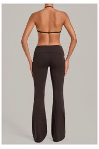 Fold-over waist yoga flare pants and halter top set, showcasing slim fit activewear details.