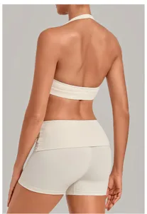 Back detail of women white halter sports bra and yoga shorts set, fitness activewear back view.