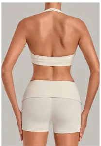 Detailed back view of a beige halter yoga bra and high waist shorts set for fitness wear.