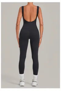 Back view detail of black open back yoga jumpsuit, seamless tight activewear design for fitness.