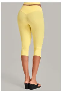 High-waisted yellow cropped yoga leggings for women, tummy control fitness activewear pants.