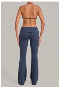 Dark blue halter sports bra and fold-over flare yoga pants workout set for women fitness wear.